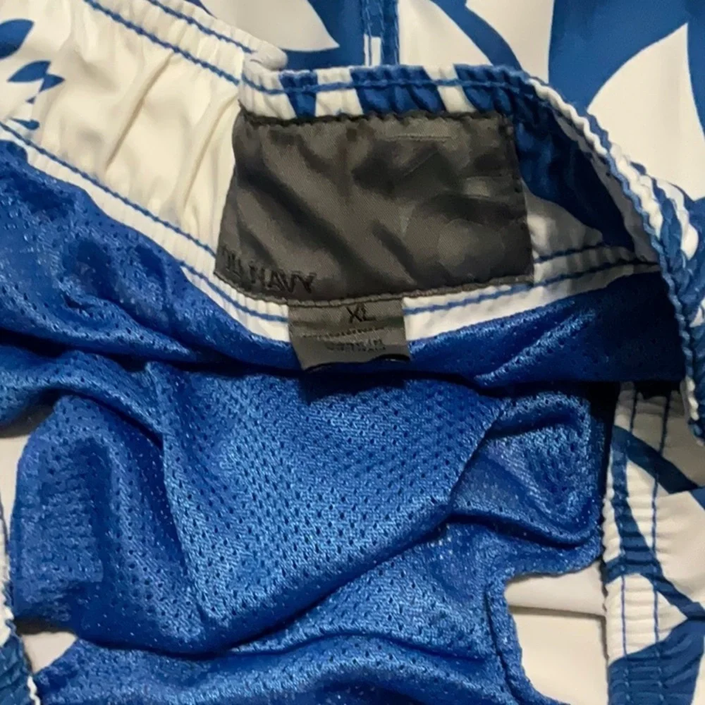 Old Navy blue & white floral swimming trunks. Size XL (40-42)